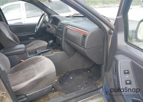 1999 Jeep Grand Cherokee Laredo from USA, damaged, VIN 1J4GW58NIXC657192